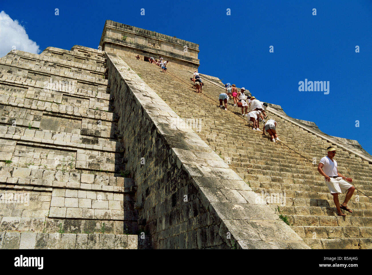 Tourists climbing El Castillo, Chichen Itza, UNESCO World Heritage Site