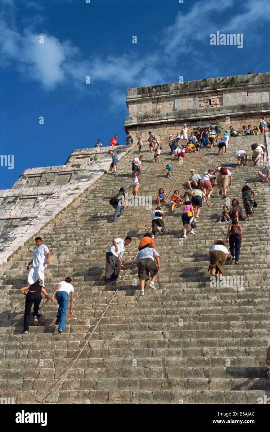 Tourists climbing El Castillo, pyramid dedicated to the god Kukulcan, Chichen Itza, Yucatan, Mexico, North America Stock Photo