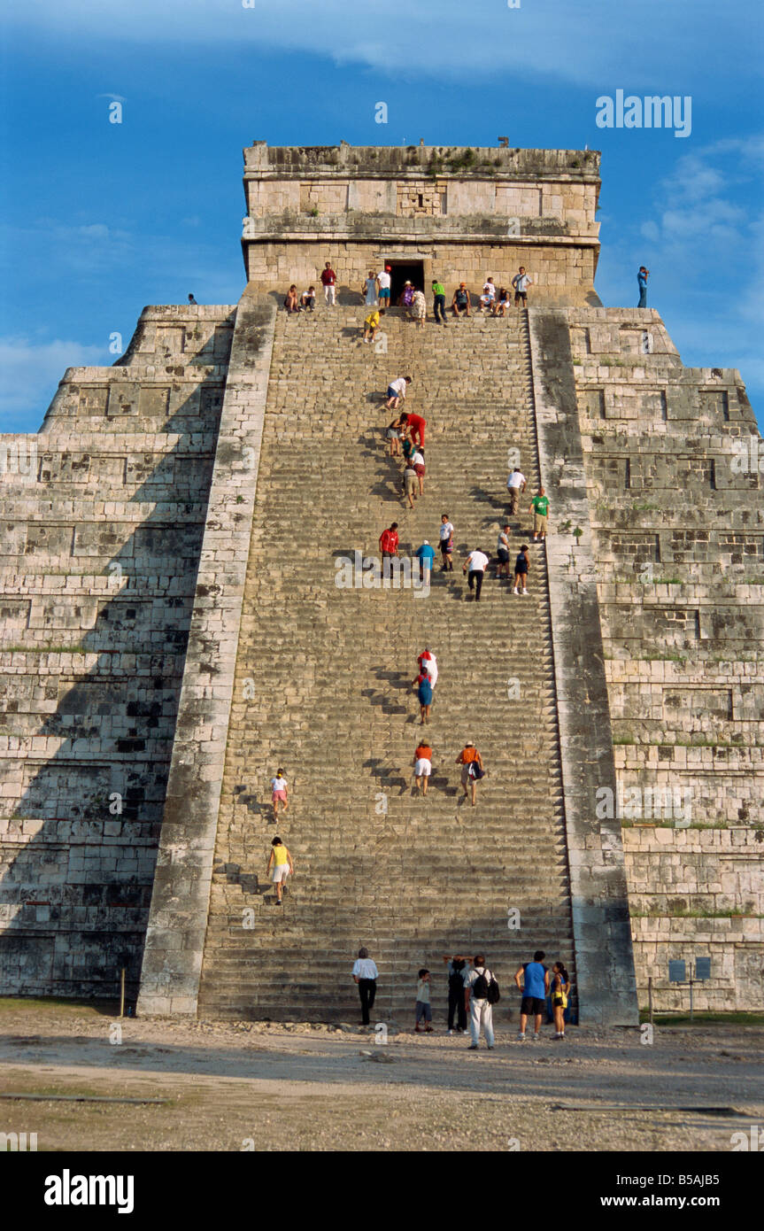 Tourists climbing El Castillo, pyramid dedicated to the god Kukulcan, Chichen Itza, Yucatan, Mexico, North America Stock Photo