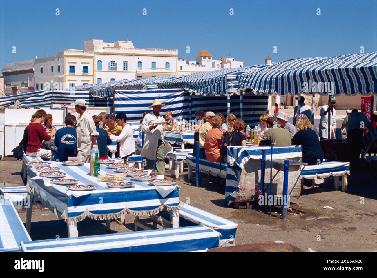 Open air fish restaurants and stalls by the sea to grill fresh fish Essaouira Morocco North Africa Africa Stock Photo
