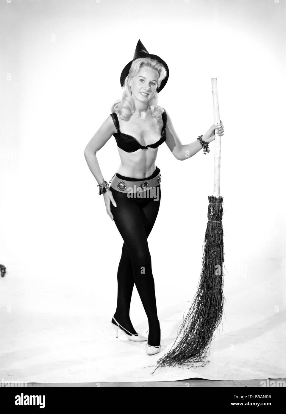 Model Brenda Bartlet dressed as a witch.  October 1959 Stock Photo