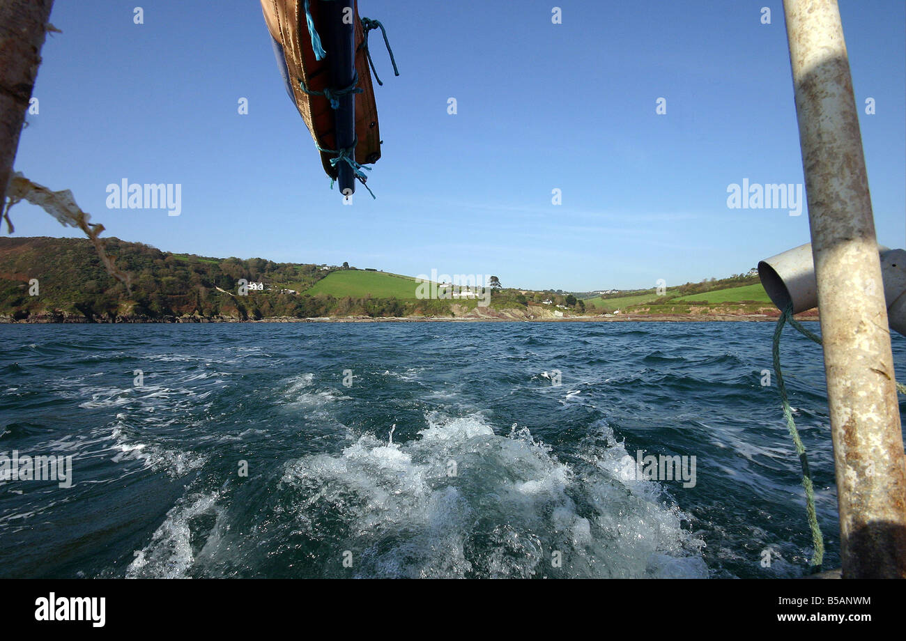 Small Boat Back looking back from a small fishing boat Stock Photo - Alamy