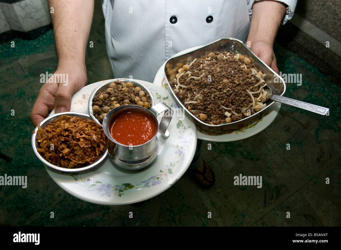 A popular traditional Egyptian national dish of Kushari also spelled ...