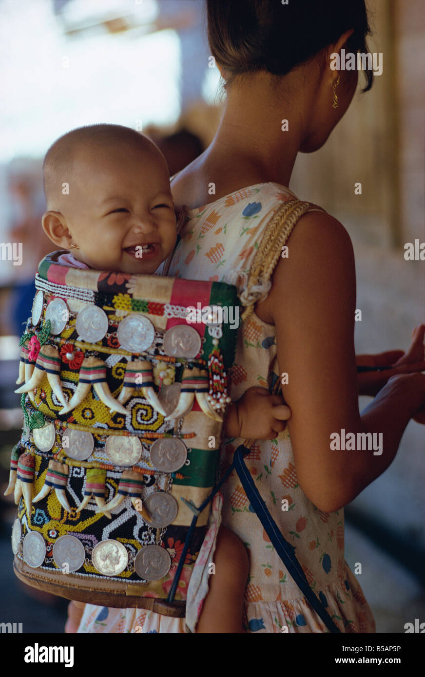 Kenyah woman with baby in a traditional carrier Kalimantan Borneo Indonesia  Asia C Leimbach Stock Photo - Alamy
