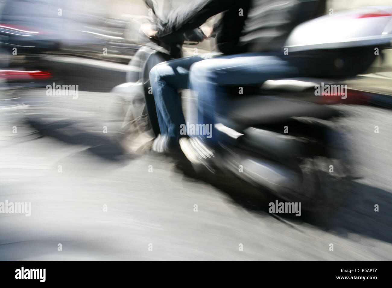 two people riding scooter moped in rome italy Stock Photo Alamy