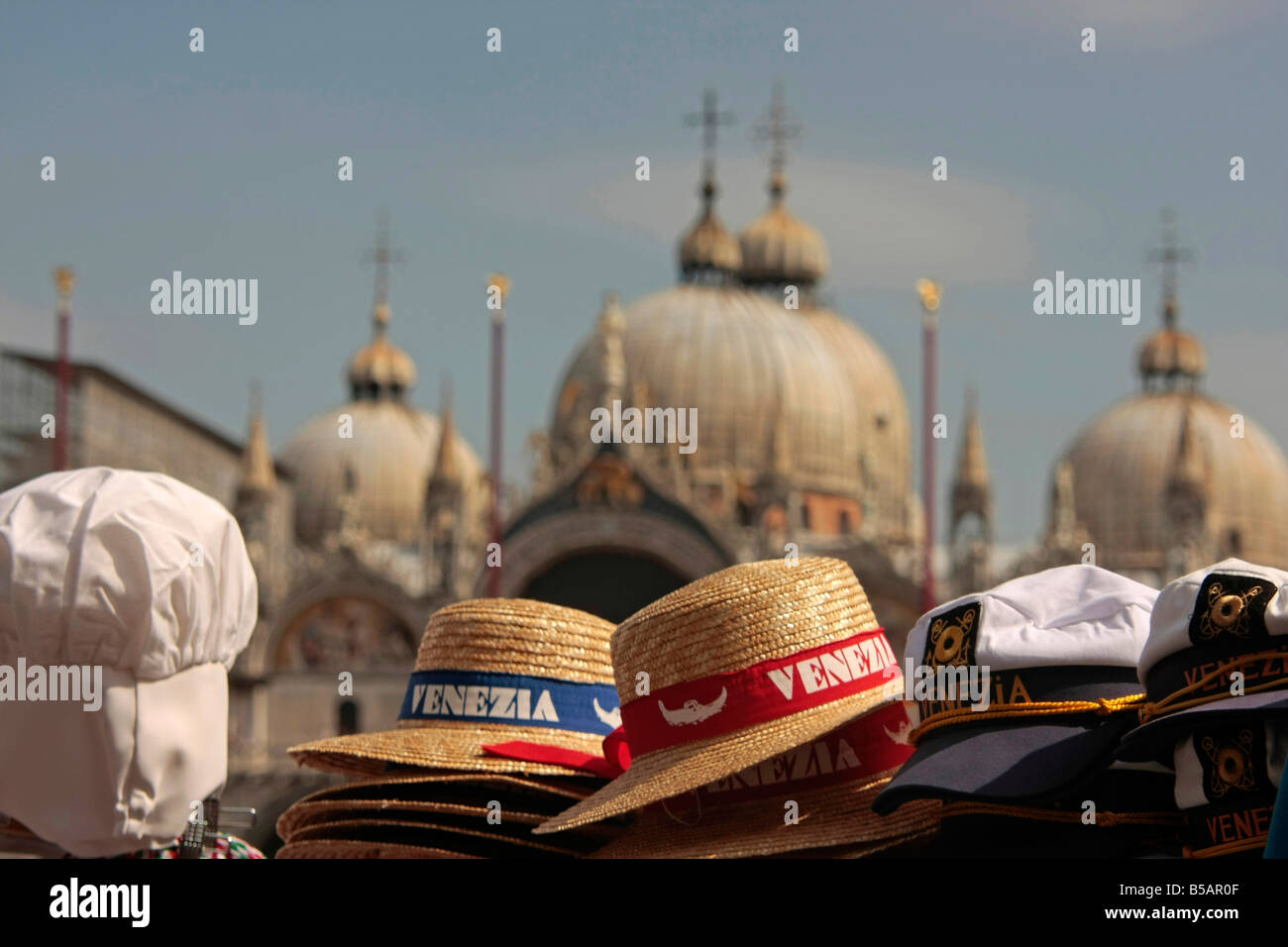 souvenir hats and St Mark s Basilica in Venice Italy Stock Photo
