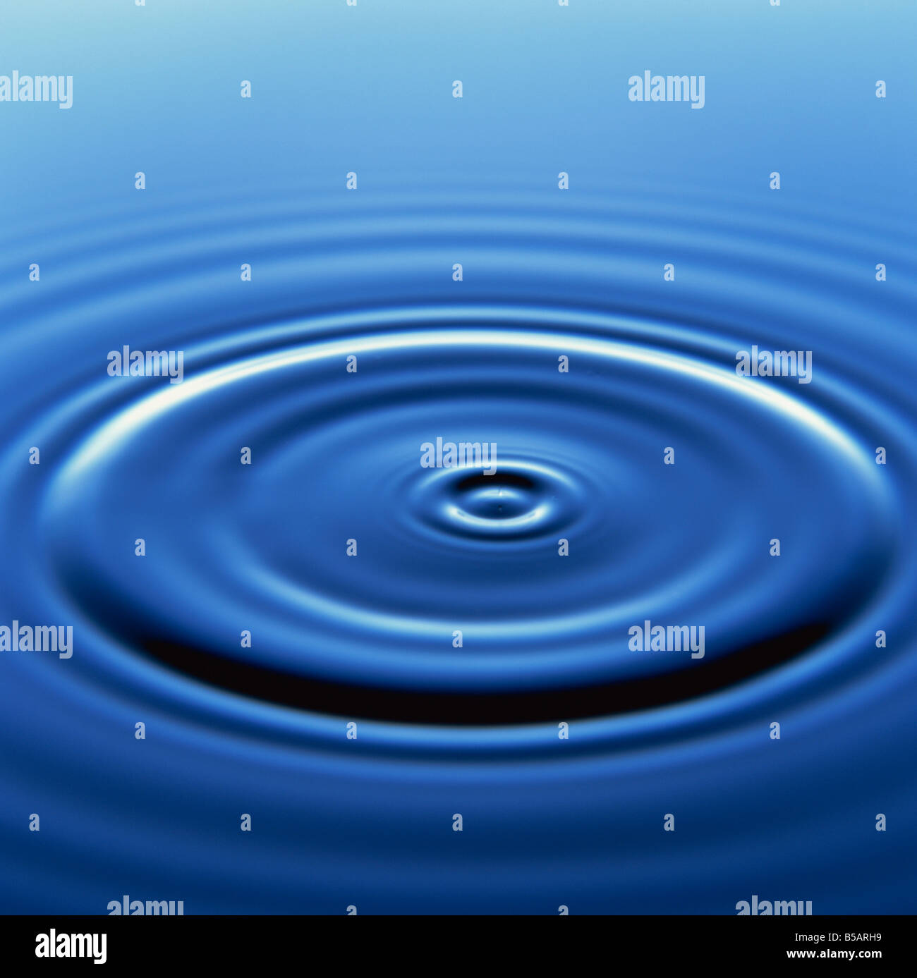 Water ripples from droplet R Rainford Stock Photo