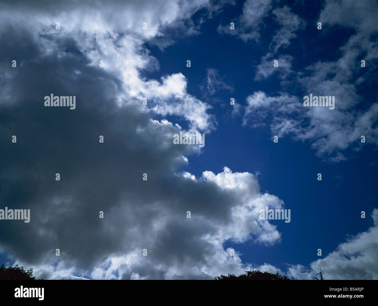 Dark clouds and blue sky Stock Photo - Alamy