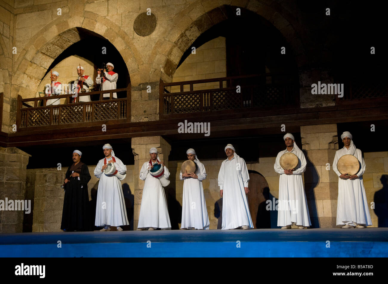 Dervish or Darvish performance of al tannoura Egyptian heritage dance troupe at the Wekalet el Ghouri Arts Center in Old Cairo Egypt Stock Photo