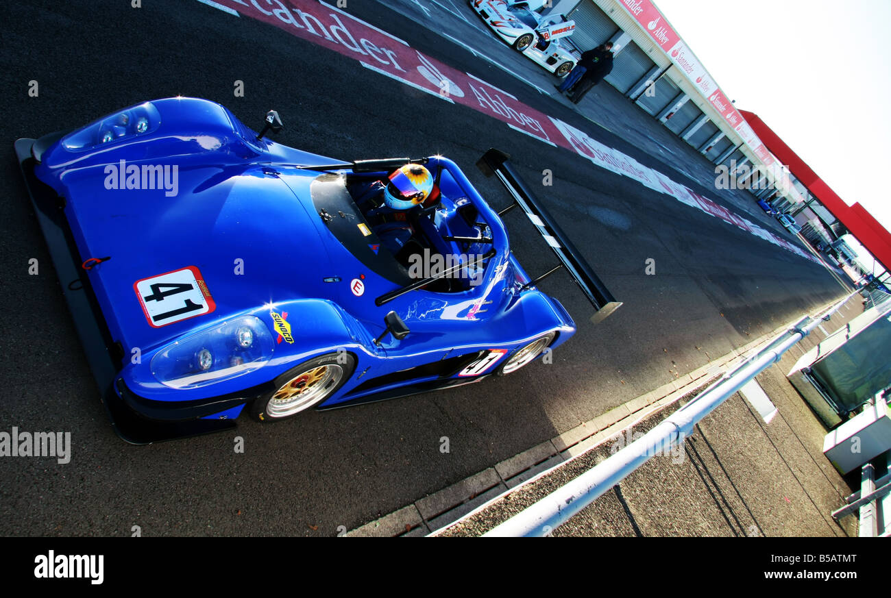 A blue Radical sports car in the pit lane at Silverstone,Northamptonshire Stock Photo