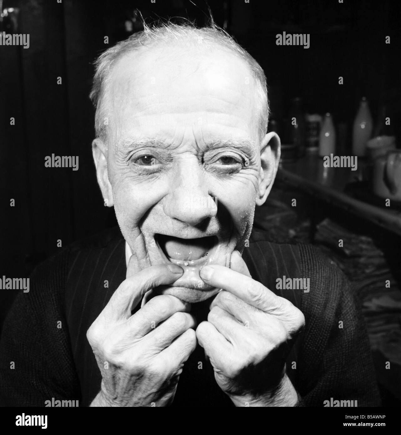 Pensioner with a new tooth. 77 year old man (George Berry) shows off his new tooth. July 1958 A702-005 Stock Photo