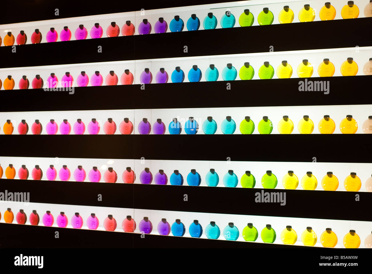 Product display of rainbow coloured bottles of shampoo in a health and beauty retail drugstore Valencia Spain Stock Photo