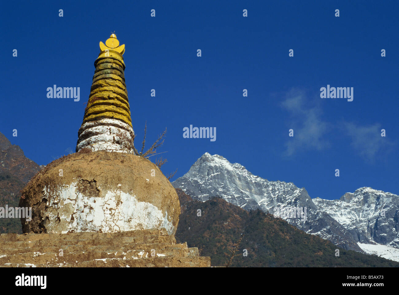 Buddhist stupa with the Himalaya mountains in the background in the ...