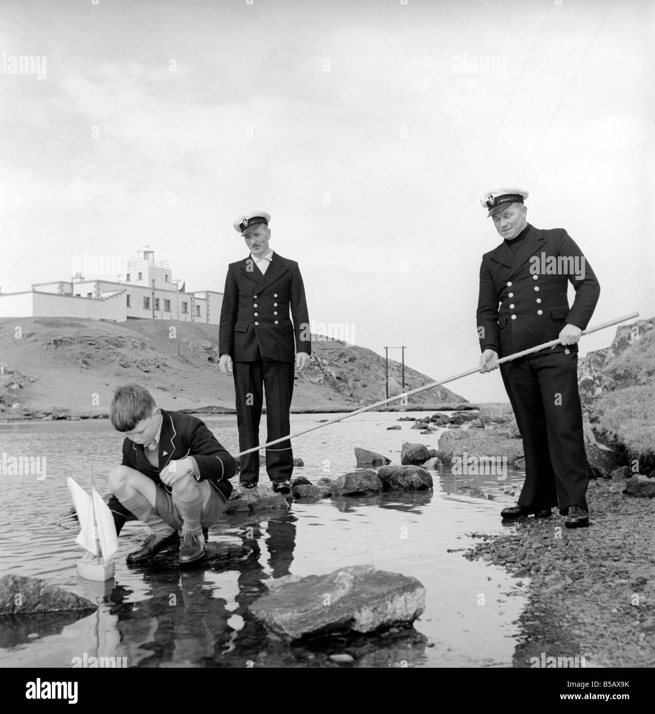 The lighthouse keepers and their families go about their daily duties