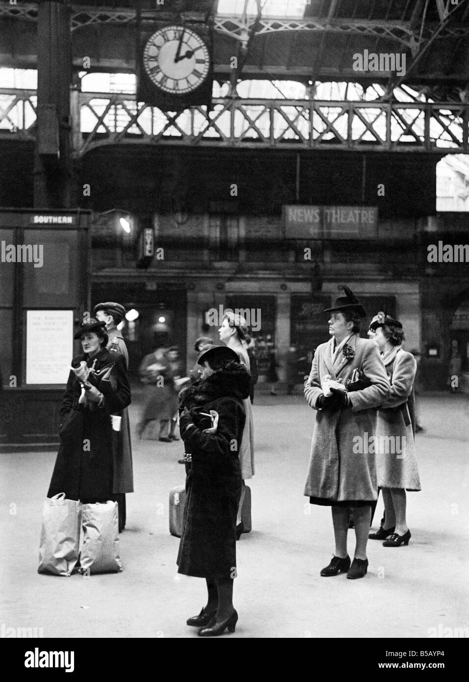 Prosaic old clock at London terminus, Victoria Station has been the arbiter of millions Stock Photo