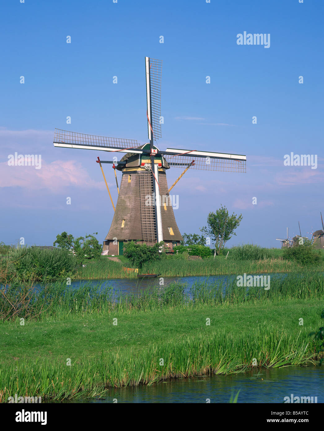 Thatched windmills on the canal at Kinderdijk Holland R Rainford Stock Photo