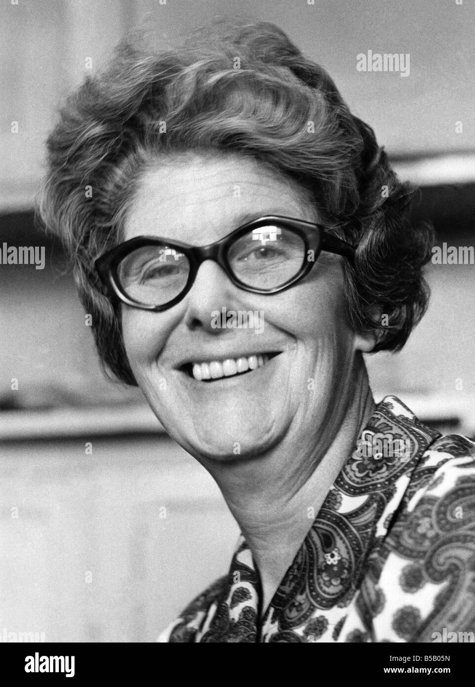 Portrait of a happy elderly woman wearing glasses.&#13;&#10;September 1974 &#13;&#10;P007861 Stock Photo