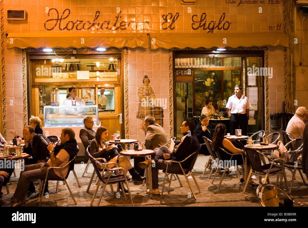 People sitting outside Horchateria El Siglo tiger nut milk cafe on Plaza Santa Catalina in El Carmen centre of Valencia Spain Stock Photo