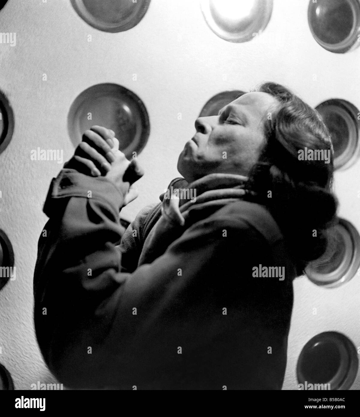 Woman clasped hands, praying&#13;&#10;March 1947 &#13;&#10;P007968 Stock Photo