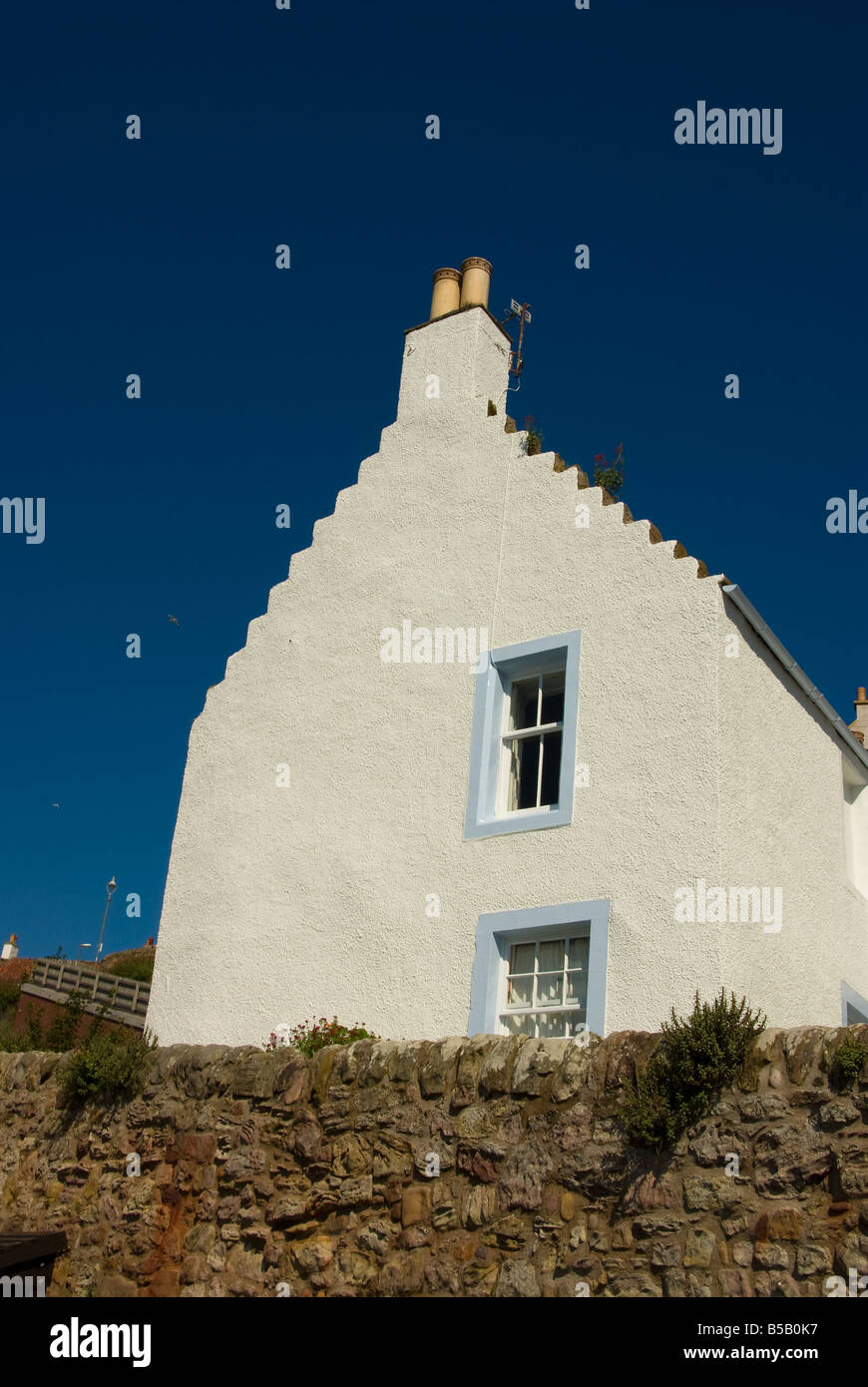 The gable end of a cottage in Fife Scotland featuring a traditional crow stepped gable. Stock Photo