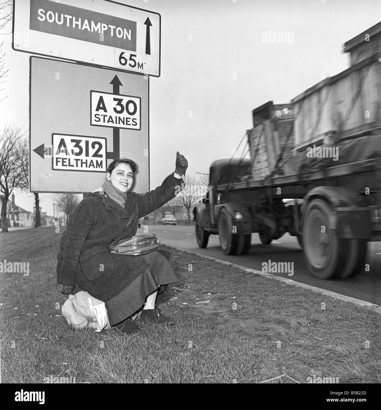 Girl hitchhiking on the A30. to Southampton Circa 1957 Stock Photo Alamy