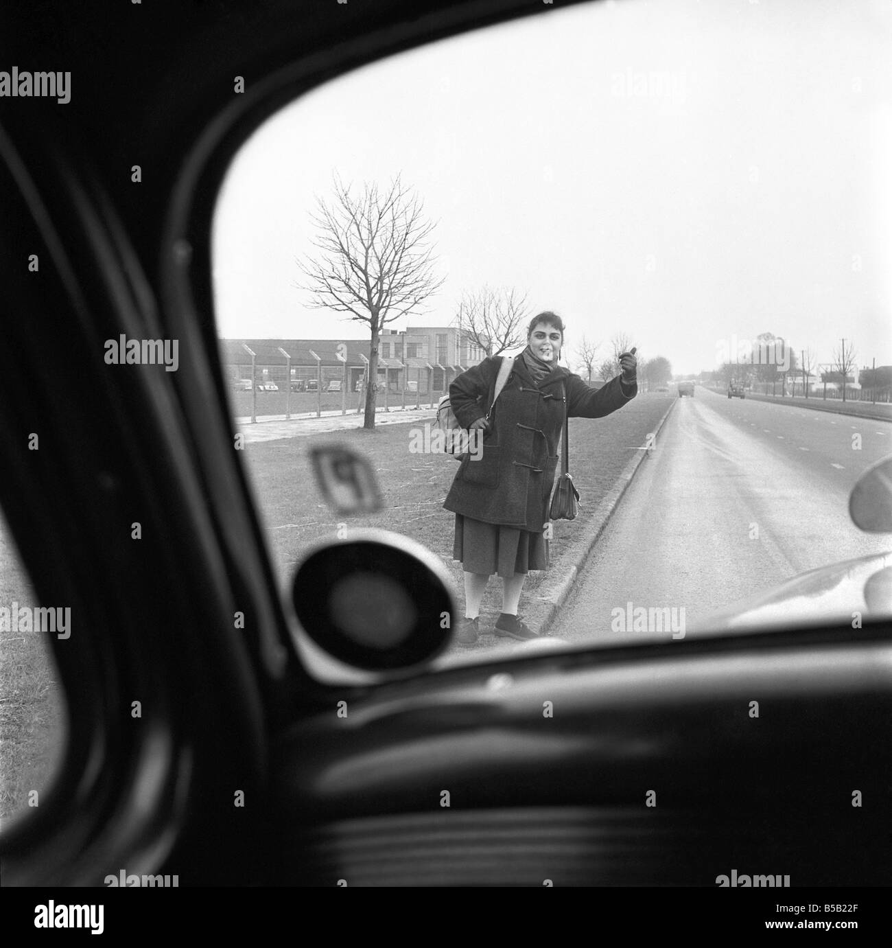 Girl hitchhiking on the A30. to Southampton Circa 1957 Stock Photo Alamy