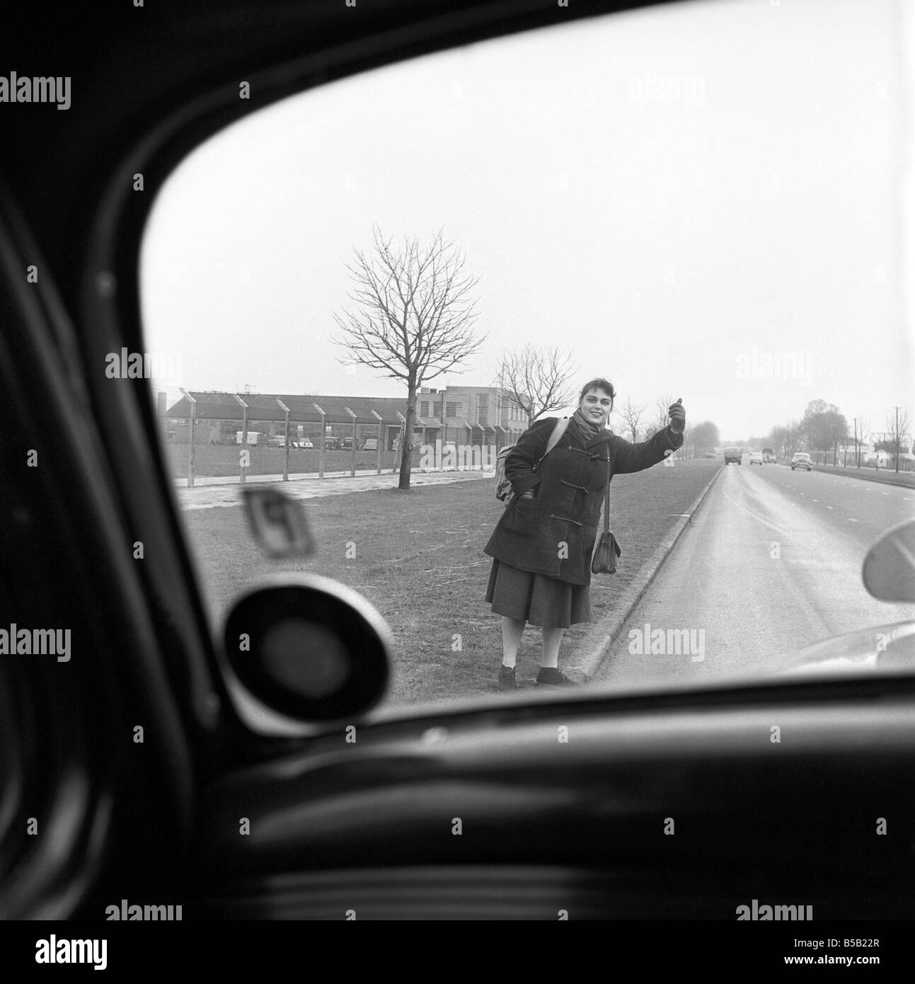 Girl hitchhiking on the A30. to Southampton Circa 1957 Stock Photo Alamy
