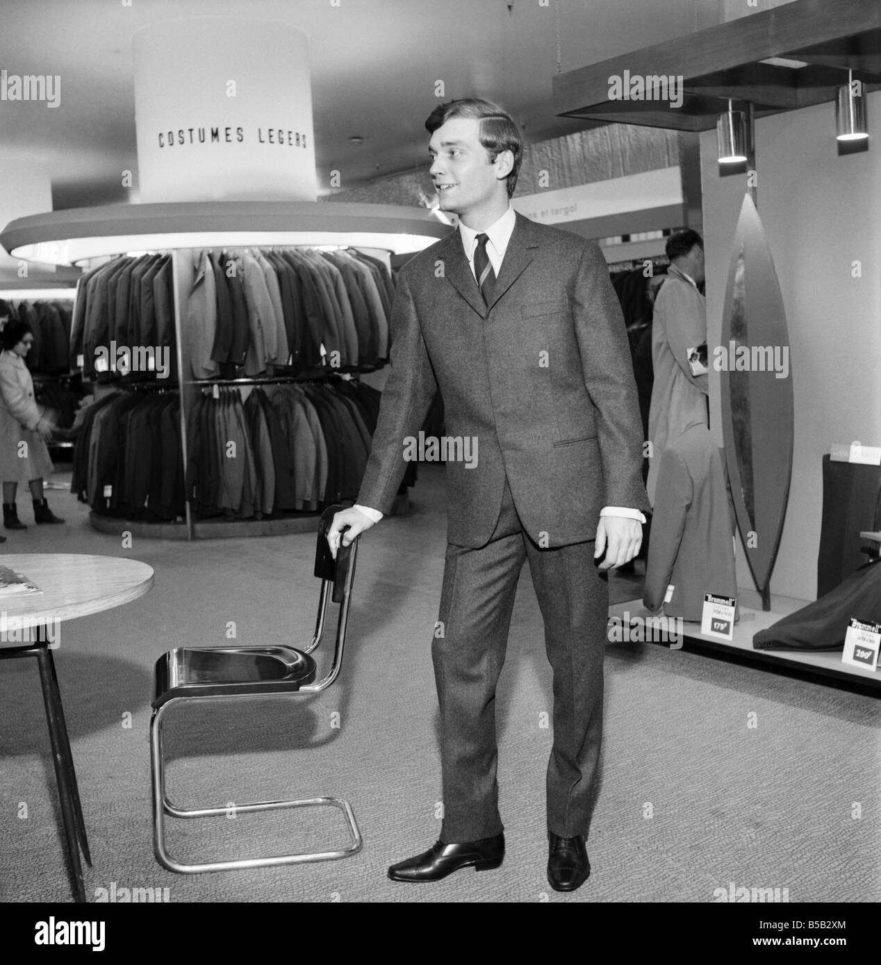 Men modelling the latest 1963 menswear design's in Paris boutique