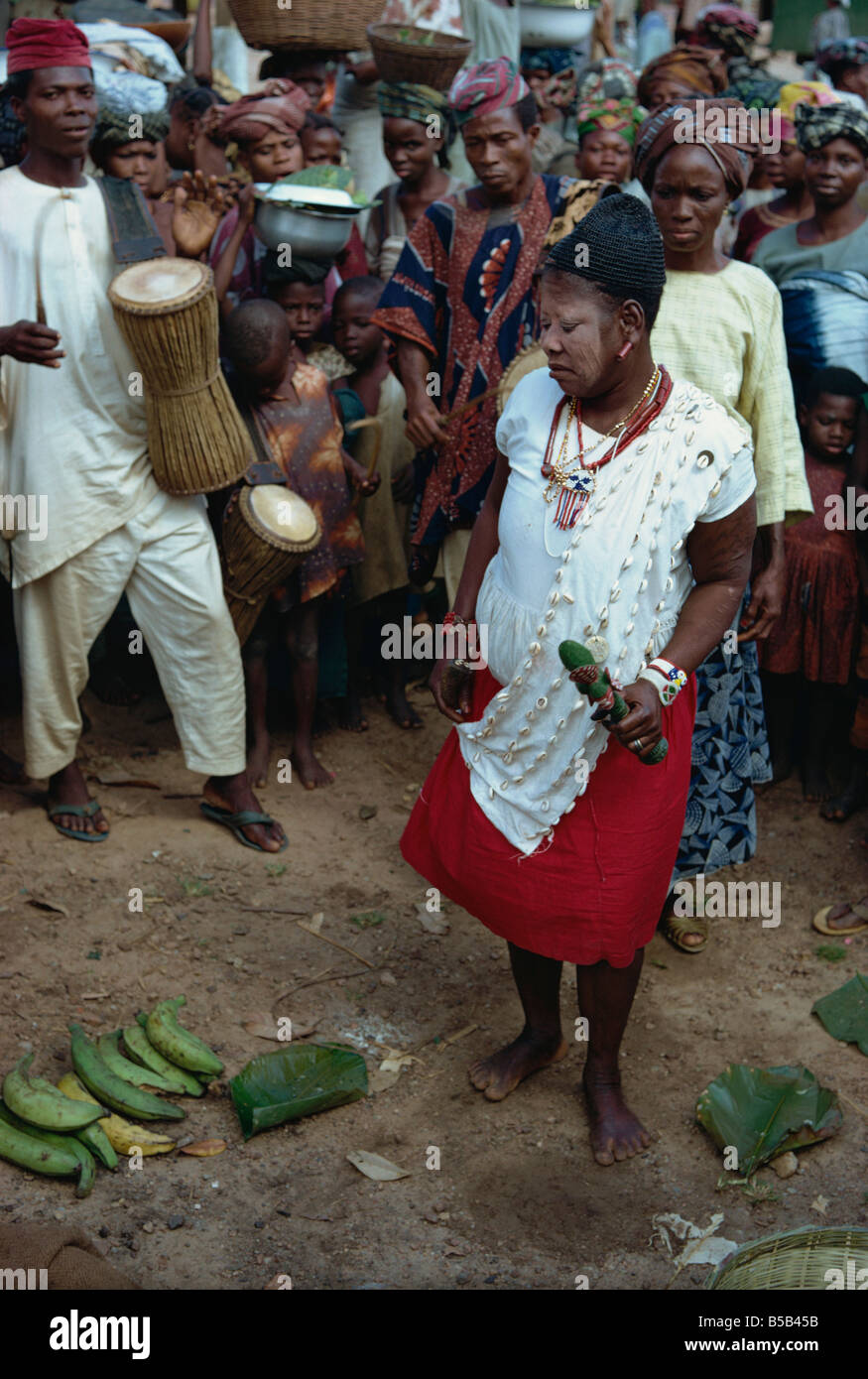 Female witch doctor in market place, Nigeria, Africa Stock Photo