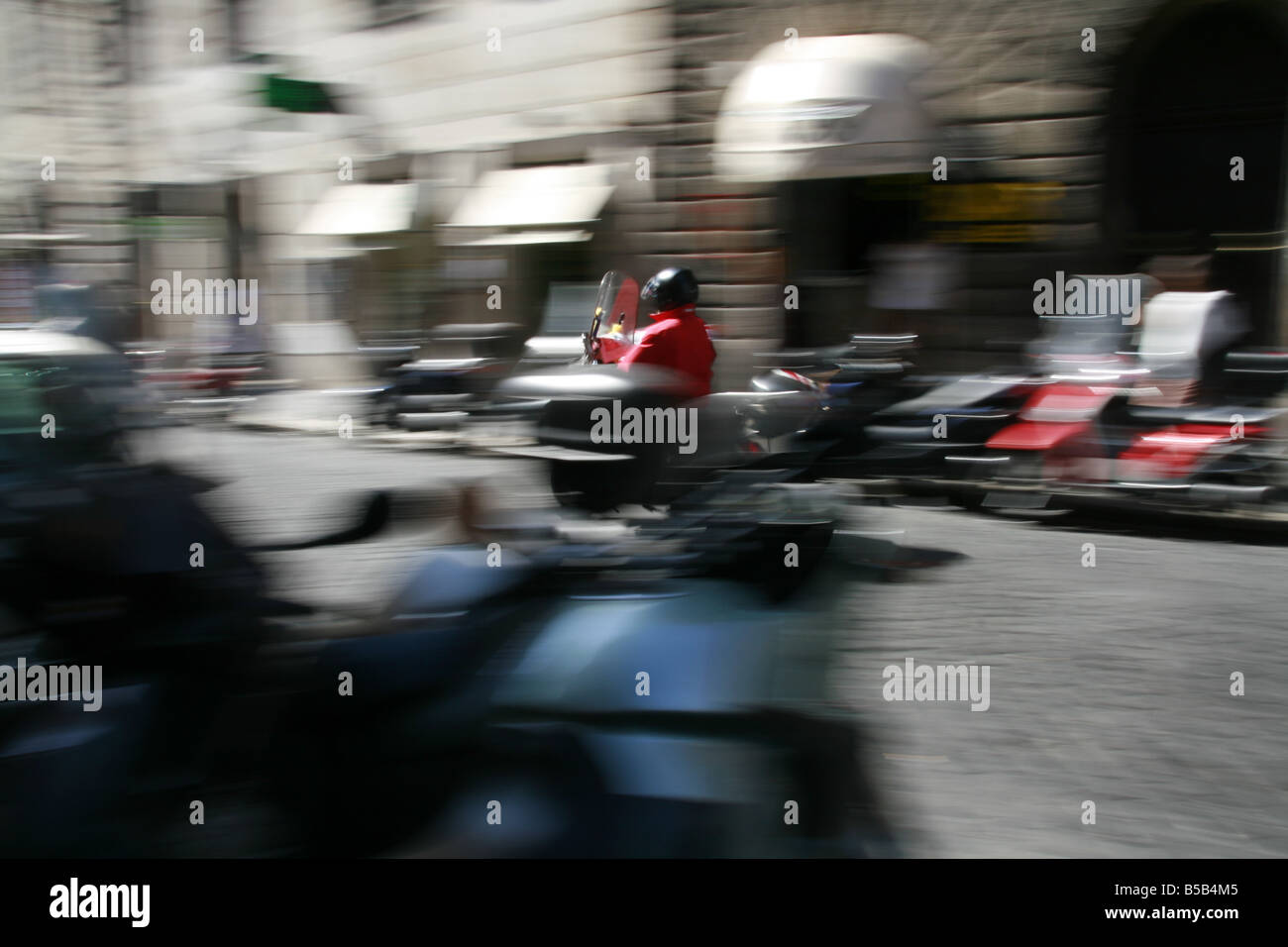 person riding scooter moped in rome italy Stock Photo Alamy