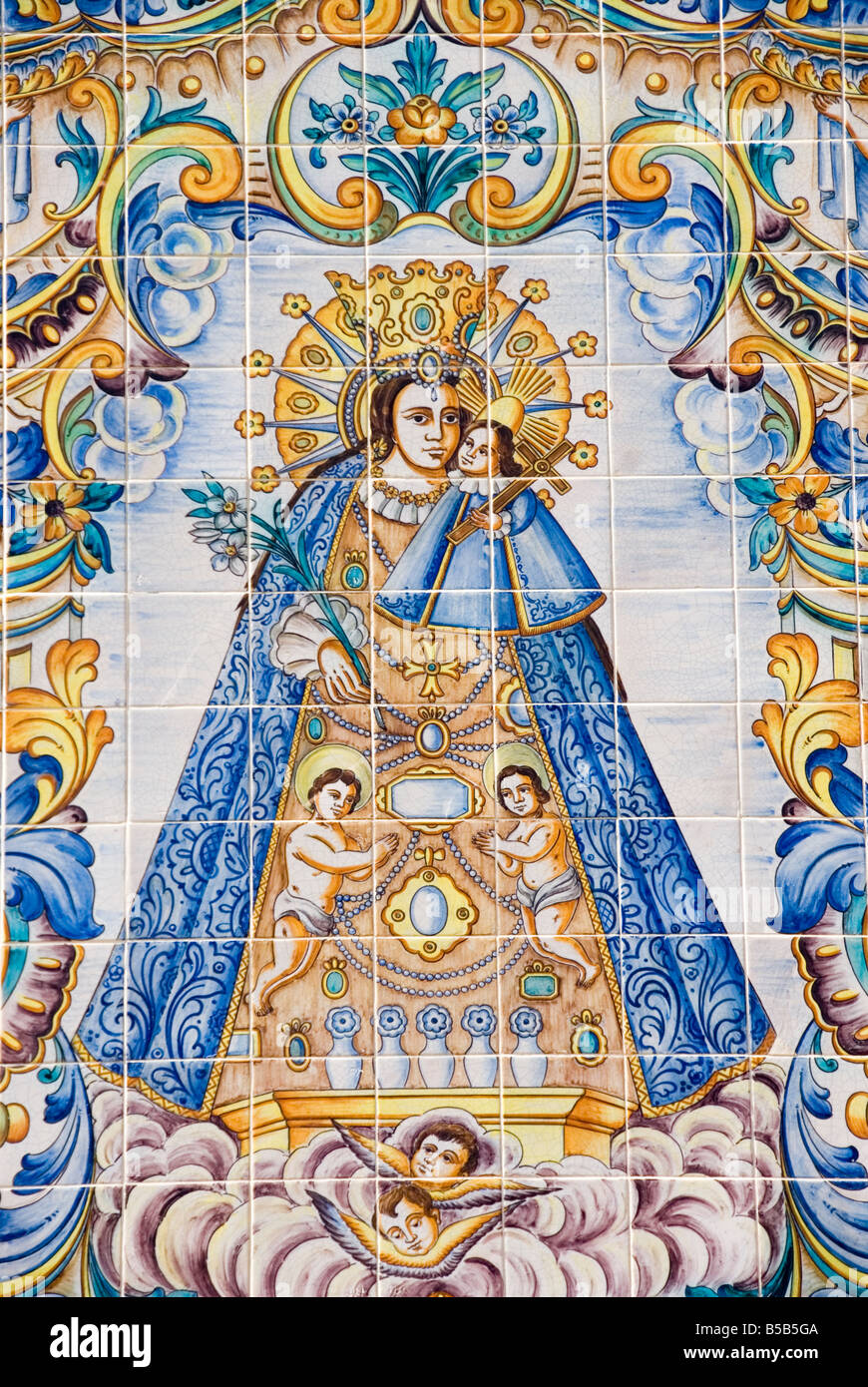 Hand painted glazed Azulejo tiles depicting the sacred statue and Patron Saint of the city of Valencia Stock Photo