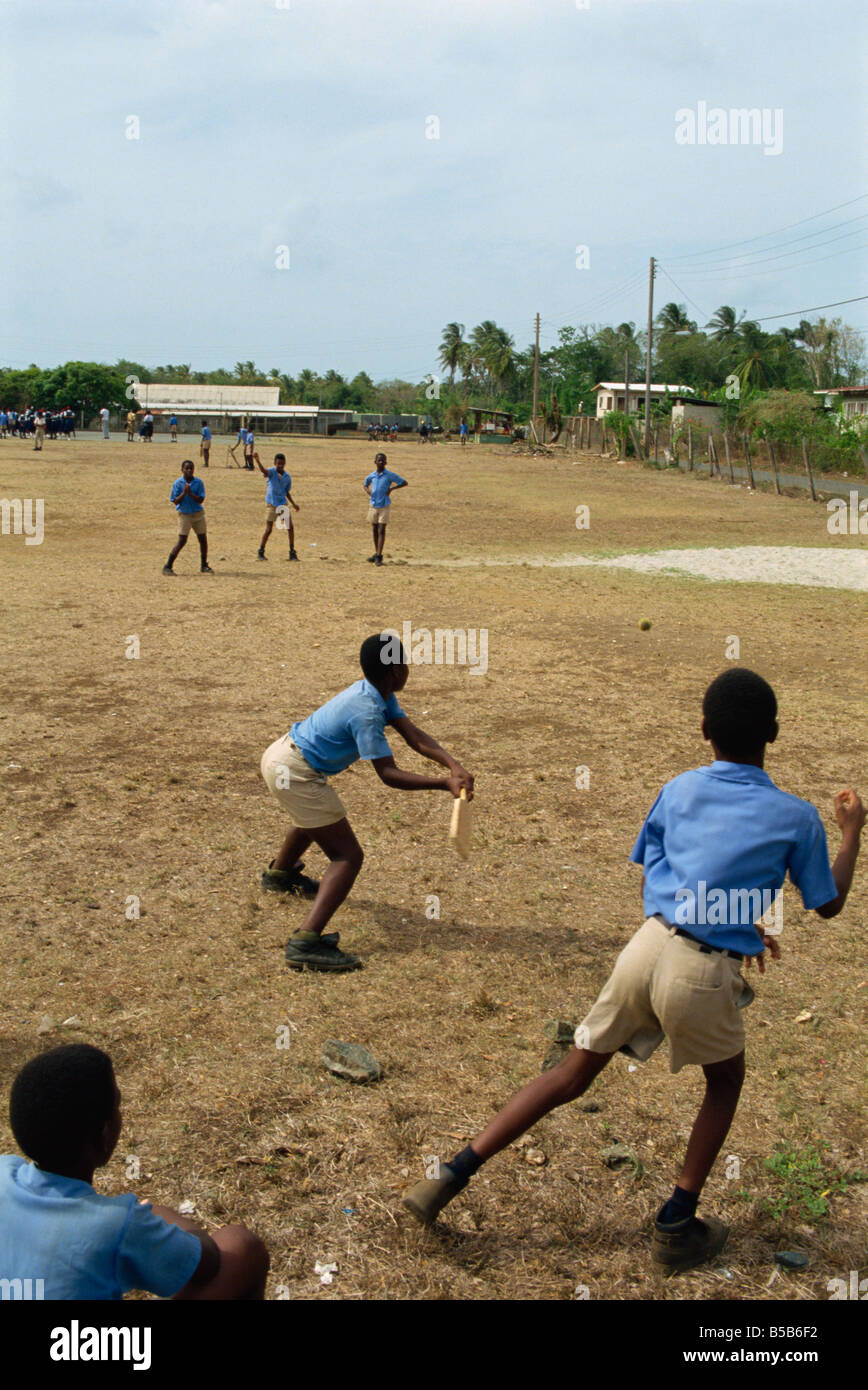 School boys playing cricket Tobago West Indies Caribbean Central America Stock Photo