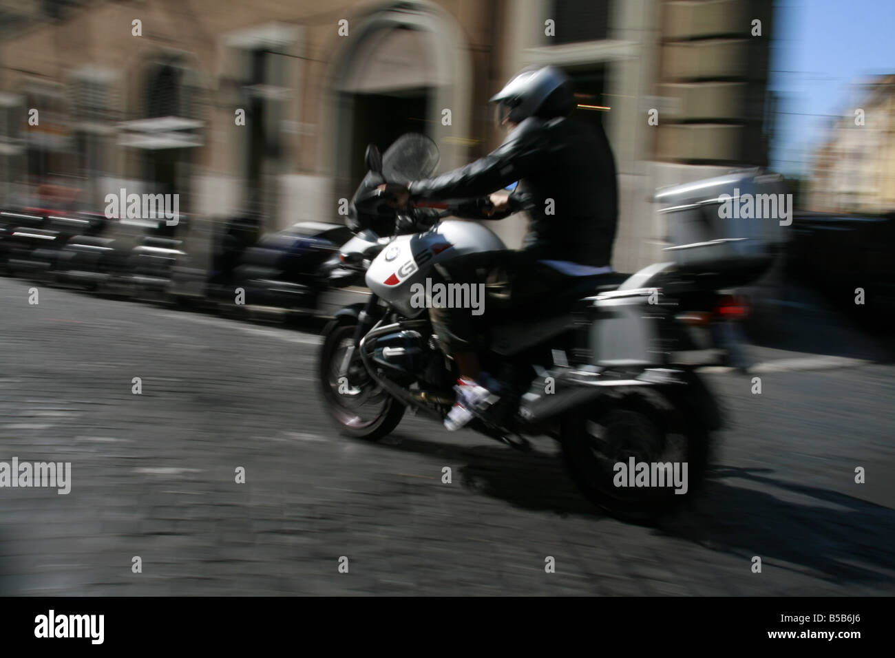 person riding scooter moped in rome italy Stock Photo Alamy