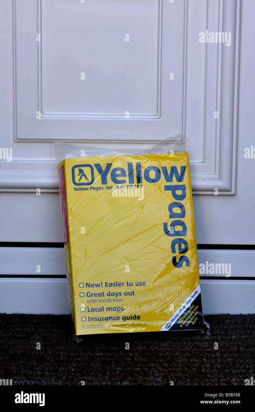 Yellow Pages on front doorstep of house UK Stock Photo