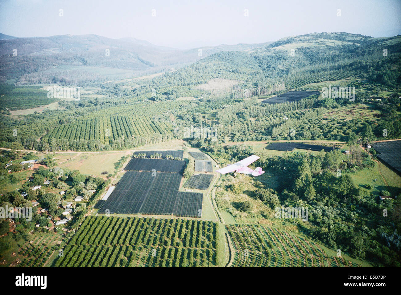South Africa, Mpumalanga, Nelspruit, Microlights in air with green landscape in background, aerial view Stock Photo