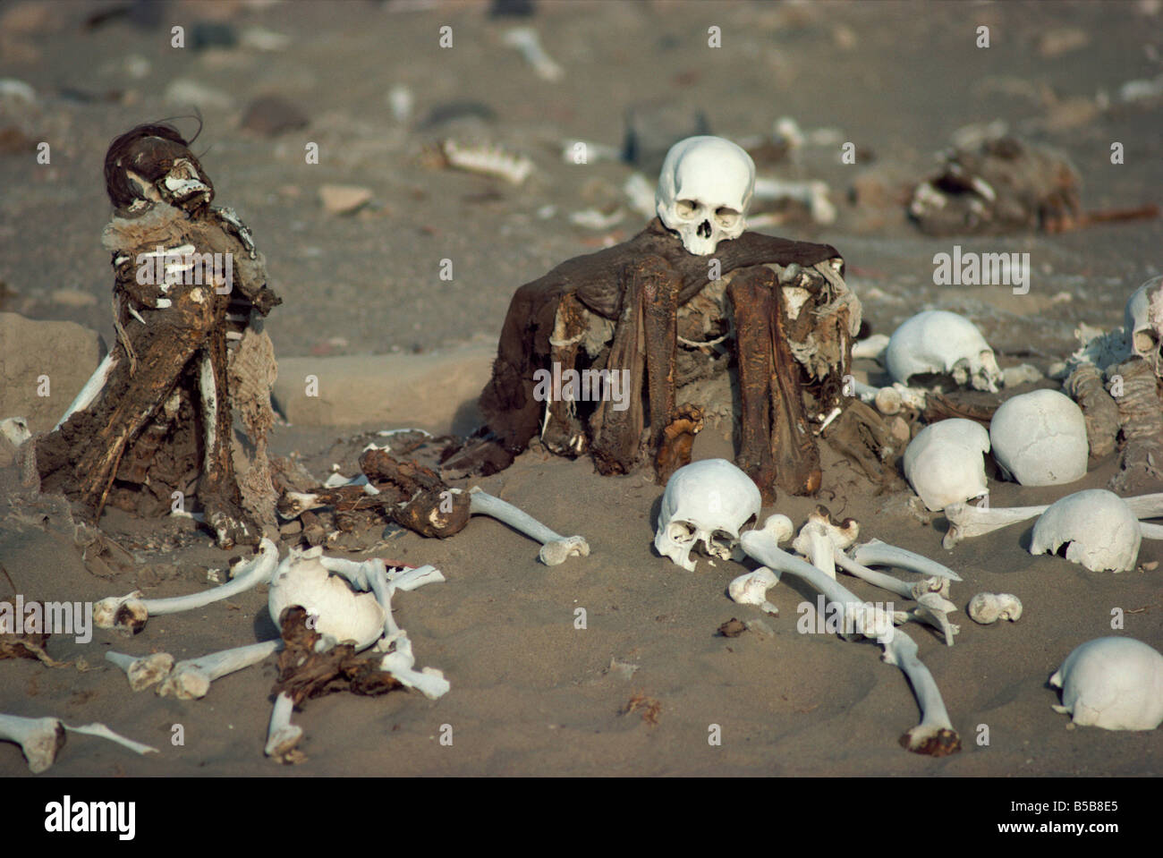 Human remains in a cemetery in the Nazca desert Peru South America R Cousins Stock Photo