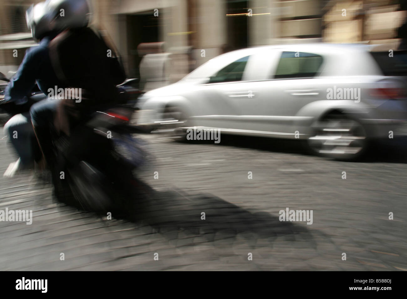person riding scooter moped in rome italy Stock Photo Alamy