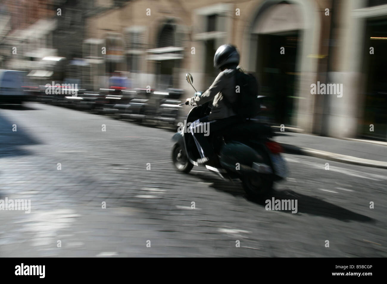 person riding scooter moped in rome italy Stock Photo Alamy