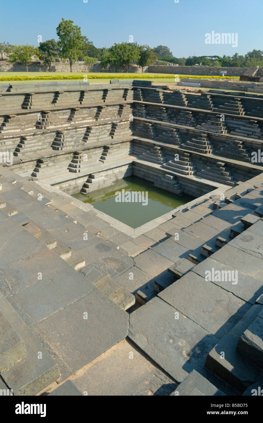 Stepped tank in the Royal Enclosure of the Unsesco World Heritage Site of Hampi, India. Stock Photo