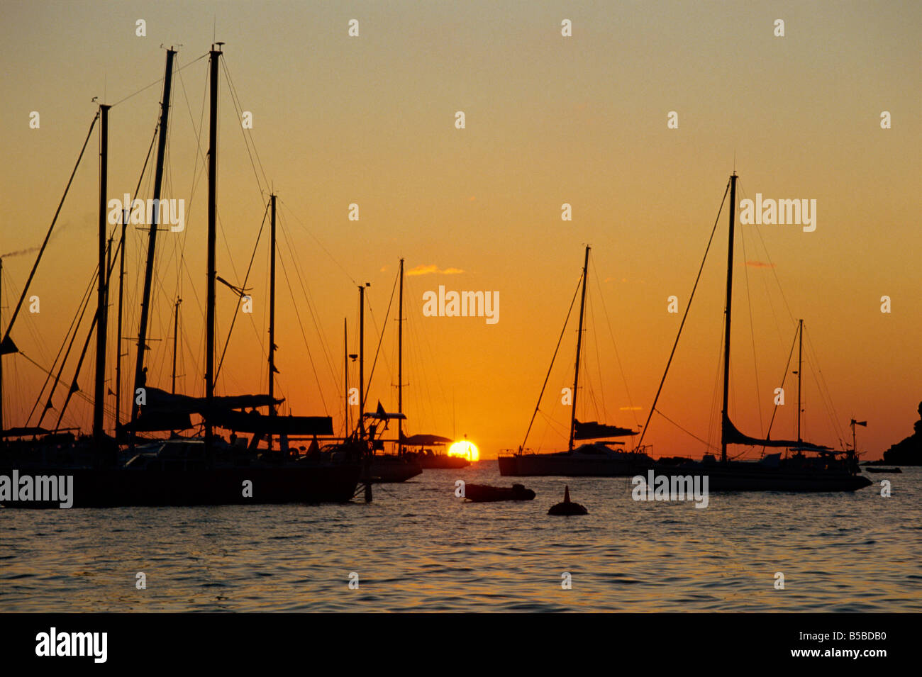 Sailing boats silhouetted moored at dusk Marigot St Martin West Indies Caribbean Central America Stock Photo