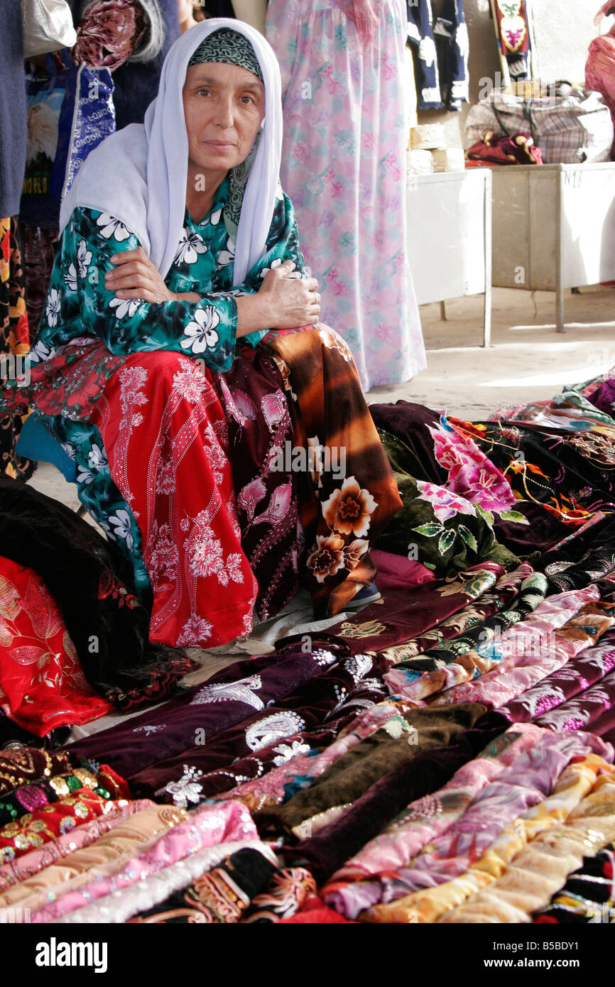 Uzbek woman selling textile, Sunday market in Urgut, Uzbekistan