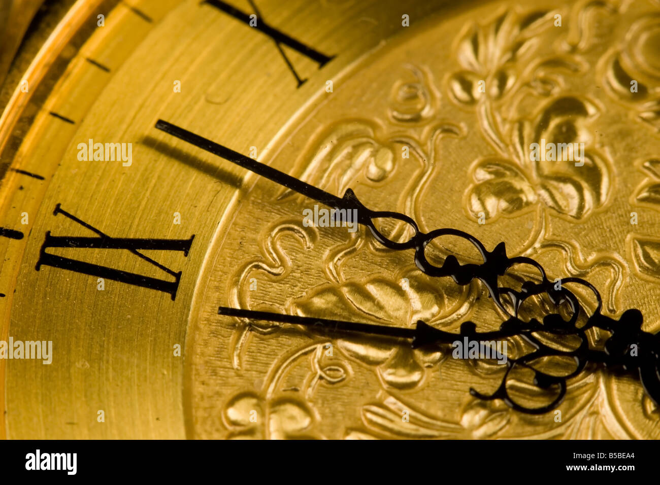 Close up view of an antique clock face with hour and minute hands Stock