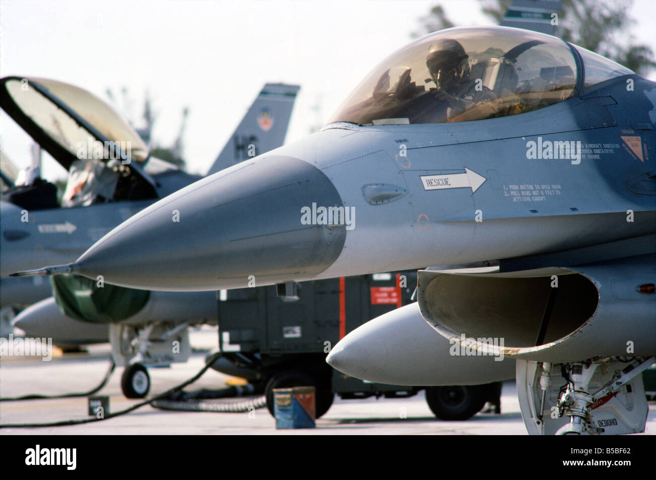 US Air Force F-16 fighter plane with Pilot in cockpit, on ground prepares for takeoff. Homestead Air Force Base, Florida Stock Photo