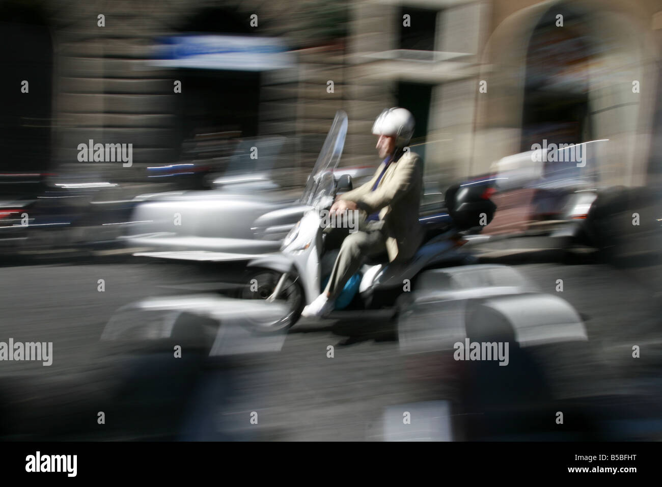person riding scooter moped in rome italy Stock Photo Alamy
