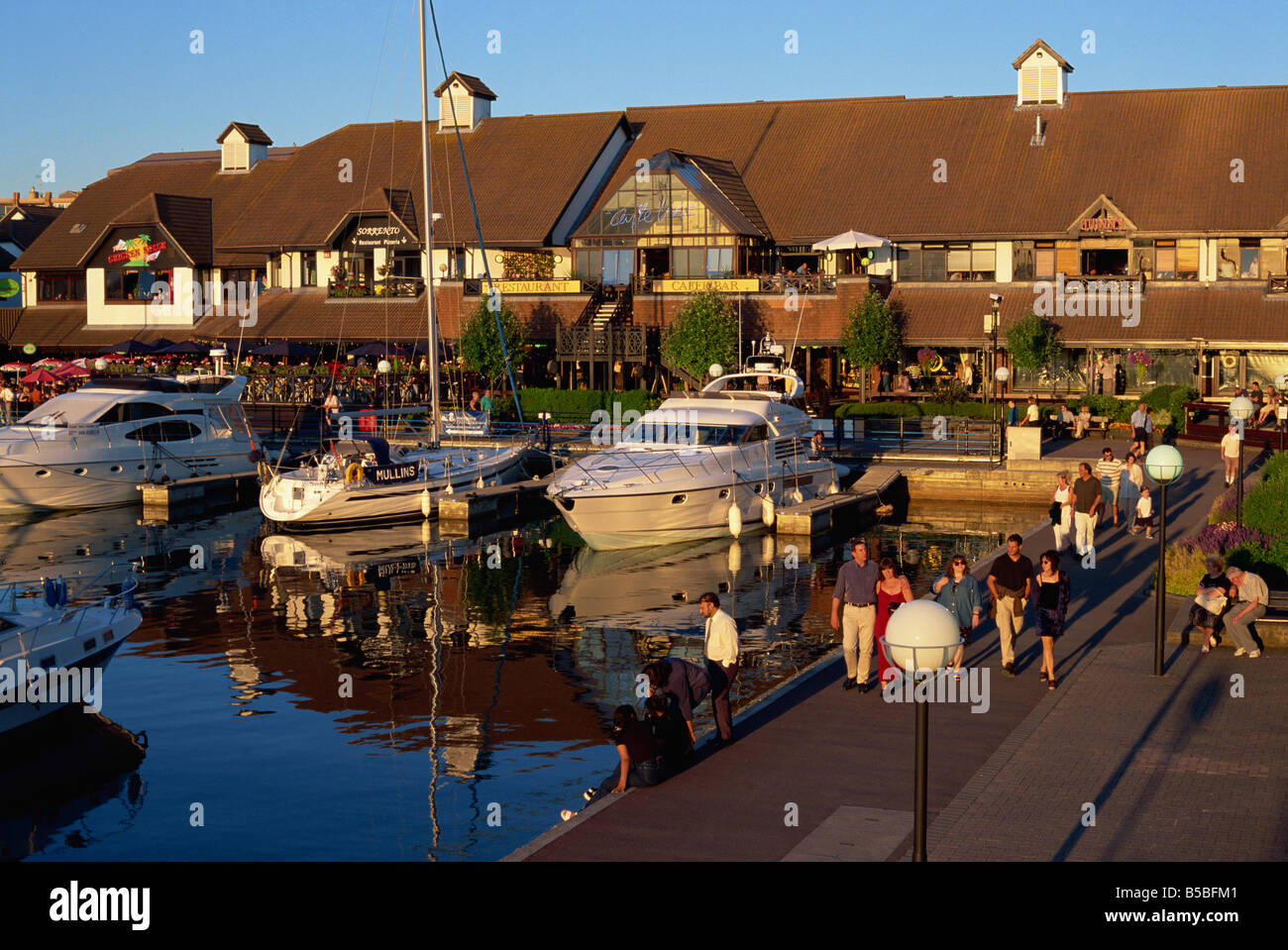 Evening strollers, Port Solent Marina, Hampshire, England, Europe Stock
