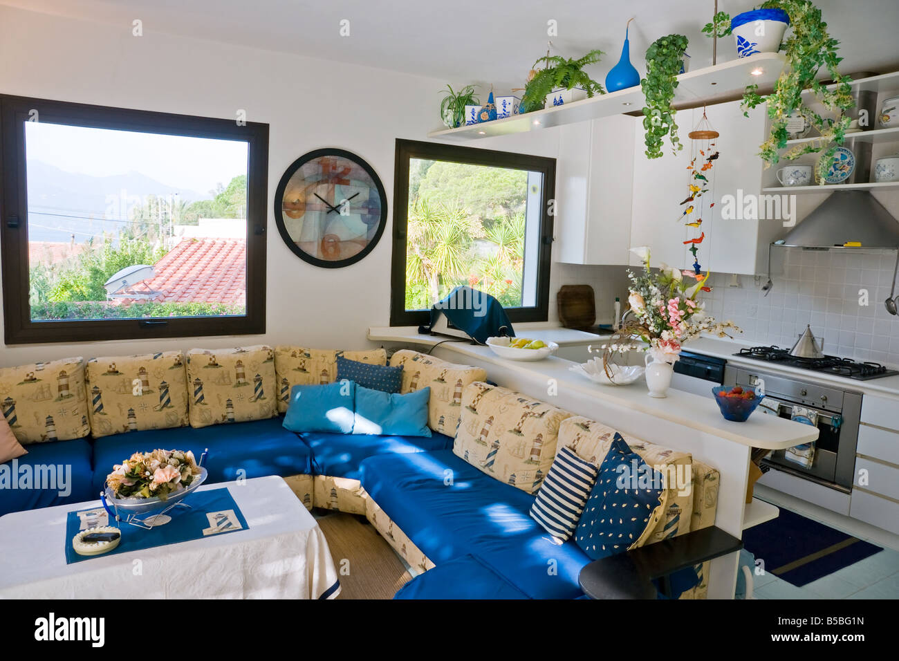 Interior of a luminous open space with kitchen Stock Photo - Alamy