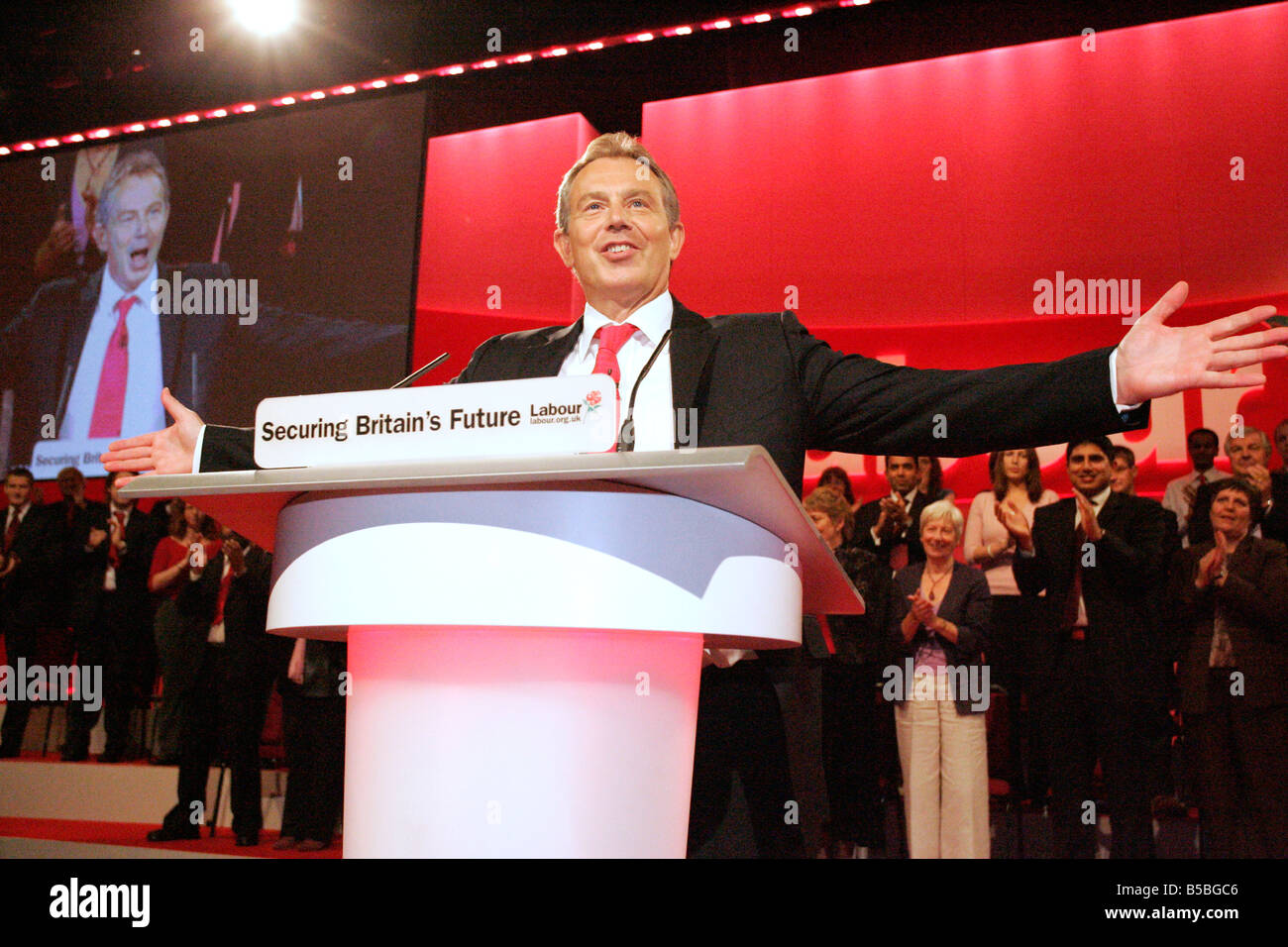 Tony Blair is welcomed by the conference before he gives his speech at