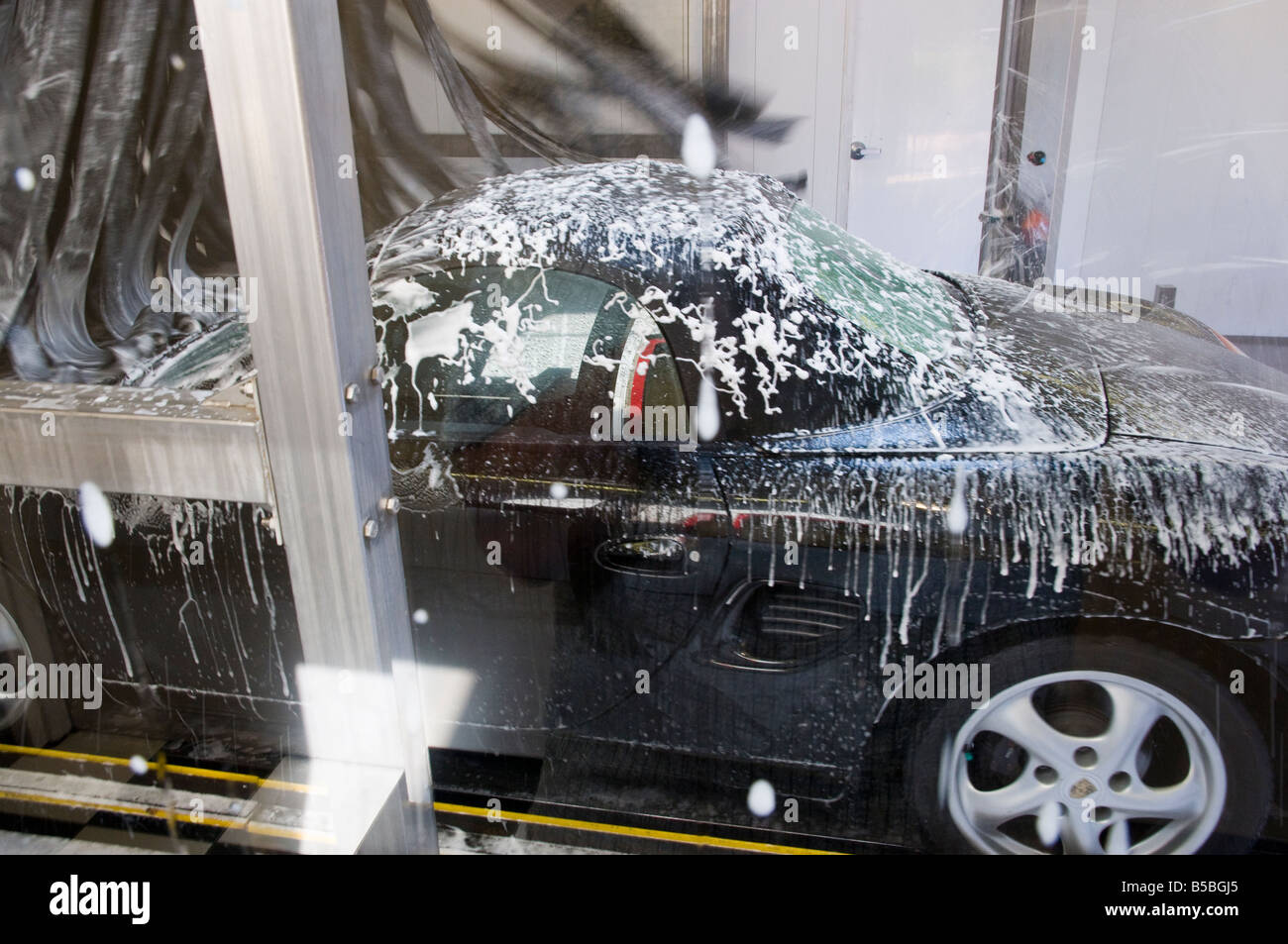 Porsche Boxster in automated Car Wash Stock Photo Alamy