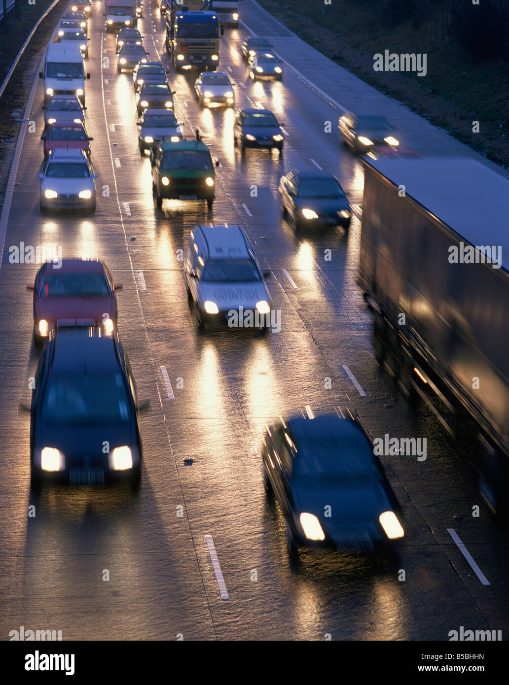 Traffic on wet motorway at dusk United Kingdom Europe Stock Photo