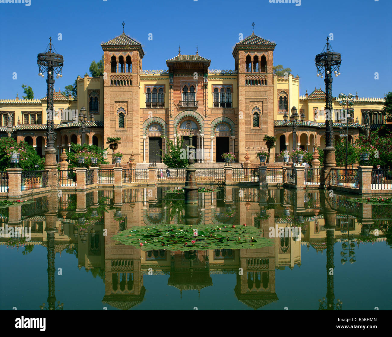 Reflections in the lily pond of buildings on the Plaza de Espana in the city of Seville Andalucia Spain Europe Stock Photo